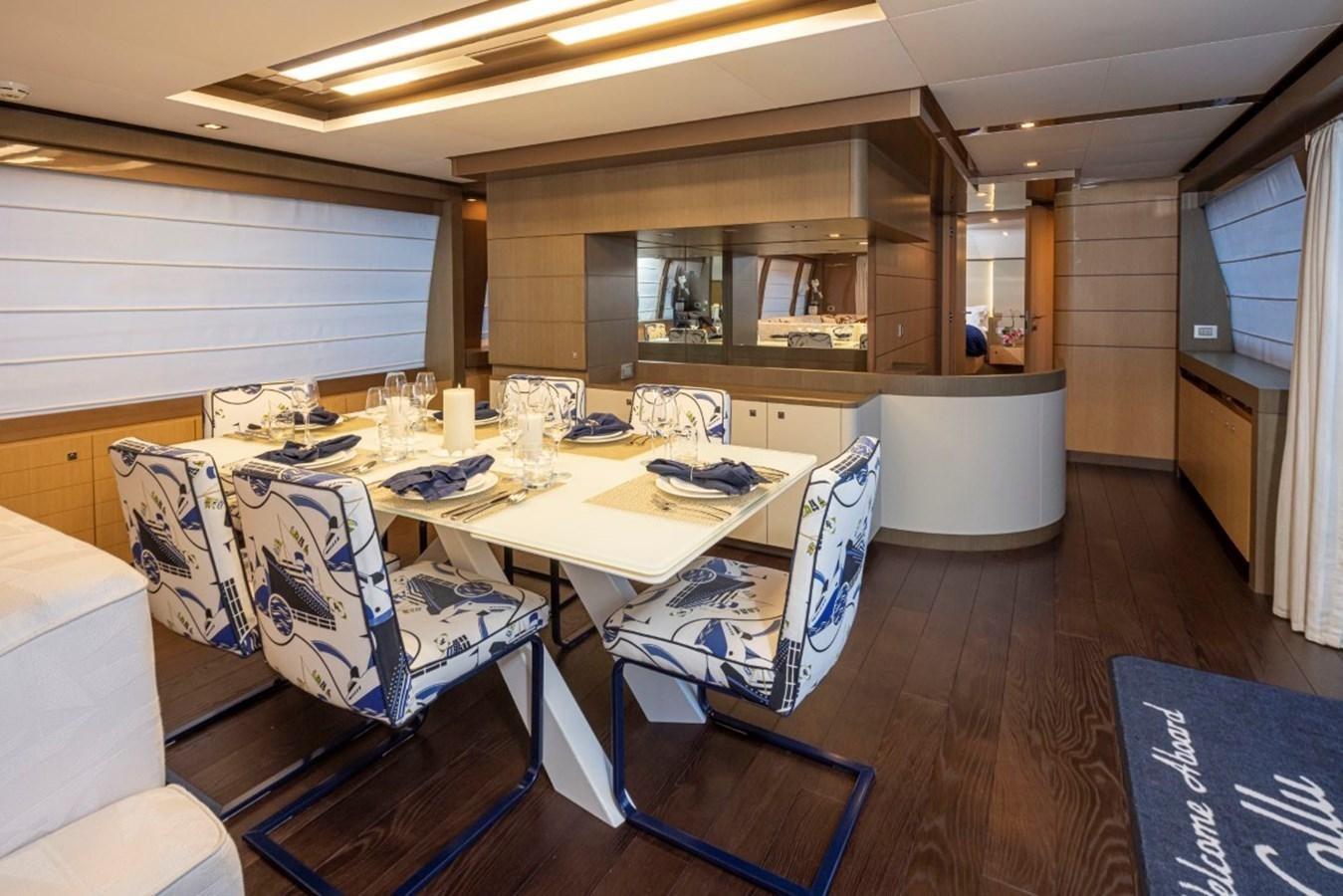a dining room with a table and chairs aboard SOL SHINE Yacht for Sale