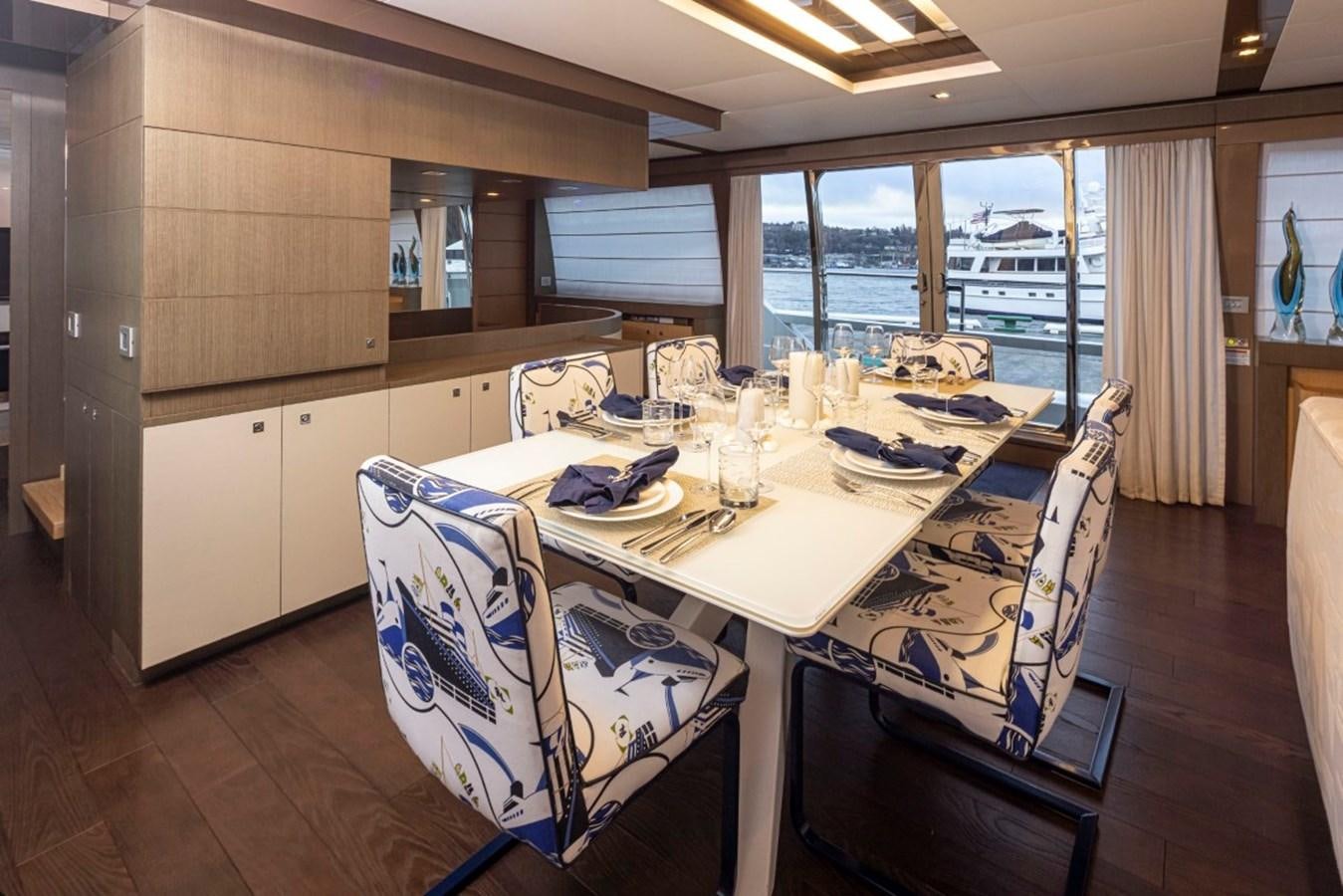 a dining table in a kitchen aboard SOL SHINE Yacht for Sale