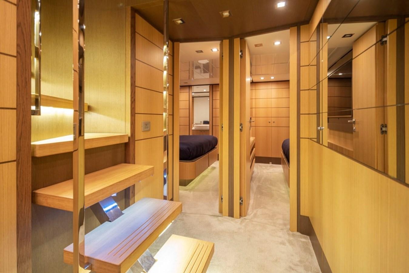 a room with wooden bunk beds aboard SOL SHINE Yacht for Sale