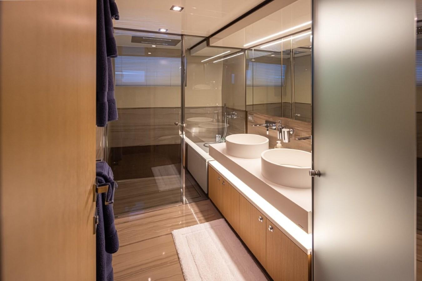 a bathroom with a sink and a mirror aboard SOL SHINE Yacht for Sale