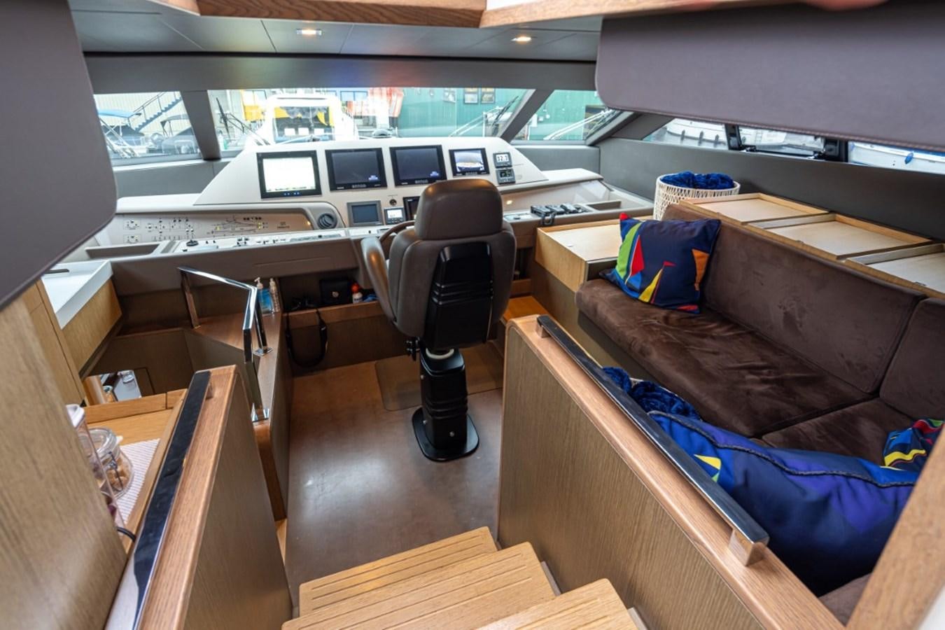 a room with a bed and desk aboard SOL SHINE Yacht for Sale