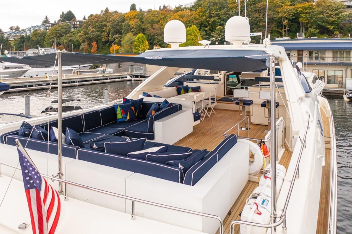 a boat with a flag on the front aboard SOL SHINE Yacht for Sale