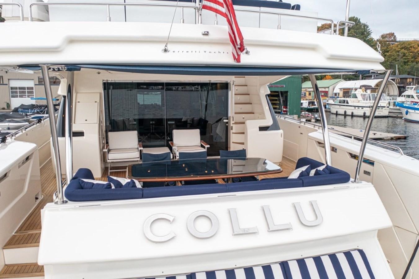 a boat with a flag on the deck aboard SOL SHINE Yacht for Sale