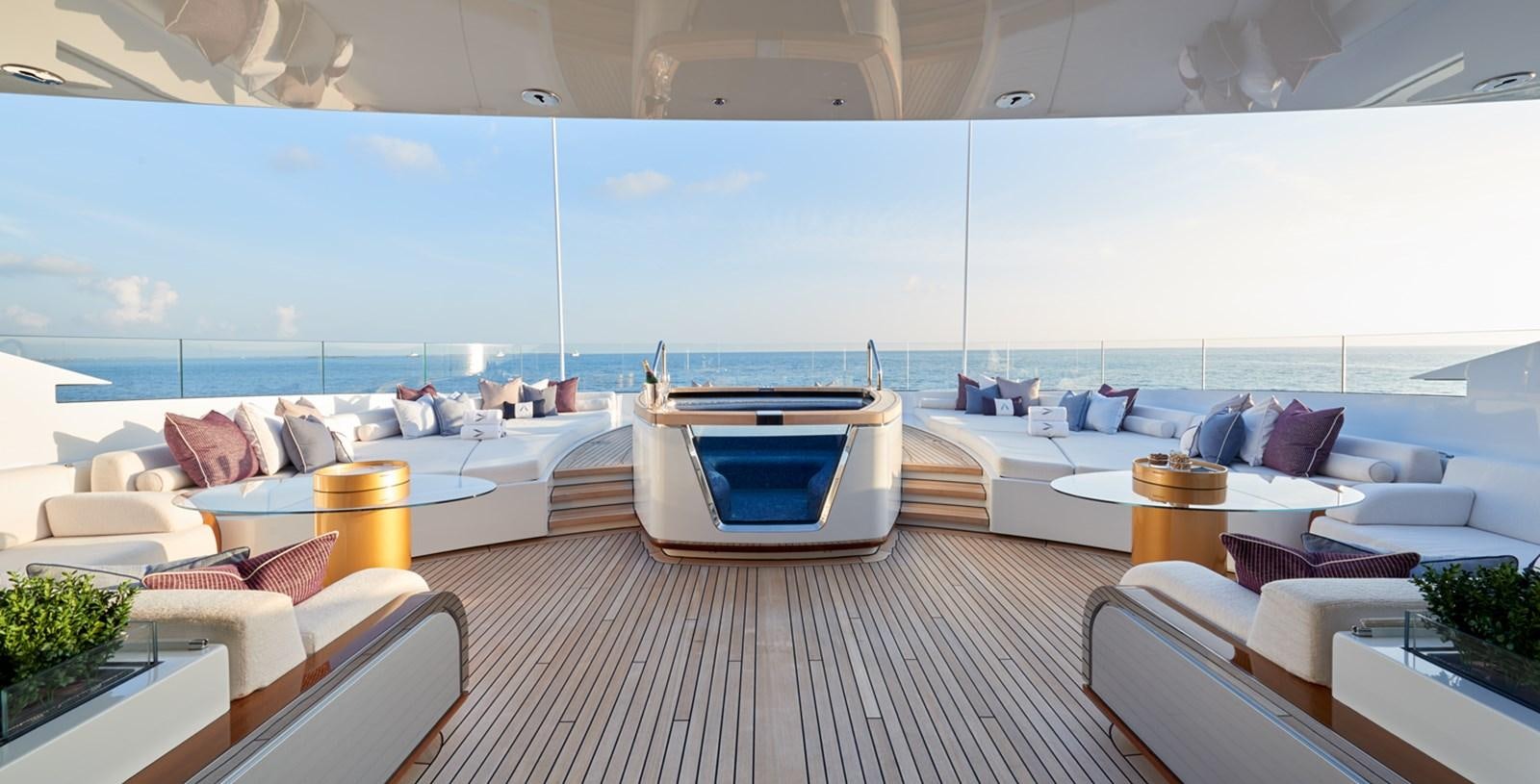 a room with a large bed and a pool aboard ARROW Yacht for Charter