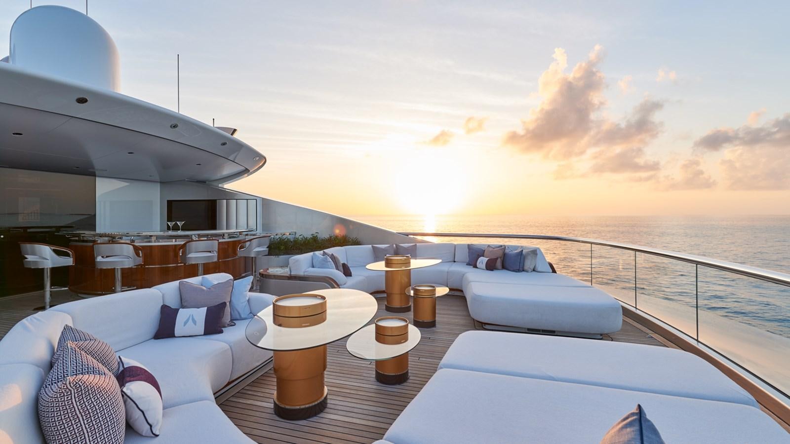 a large white lounge chair on a boat in the ocean aboard ARROW Yacht for Charter