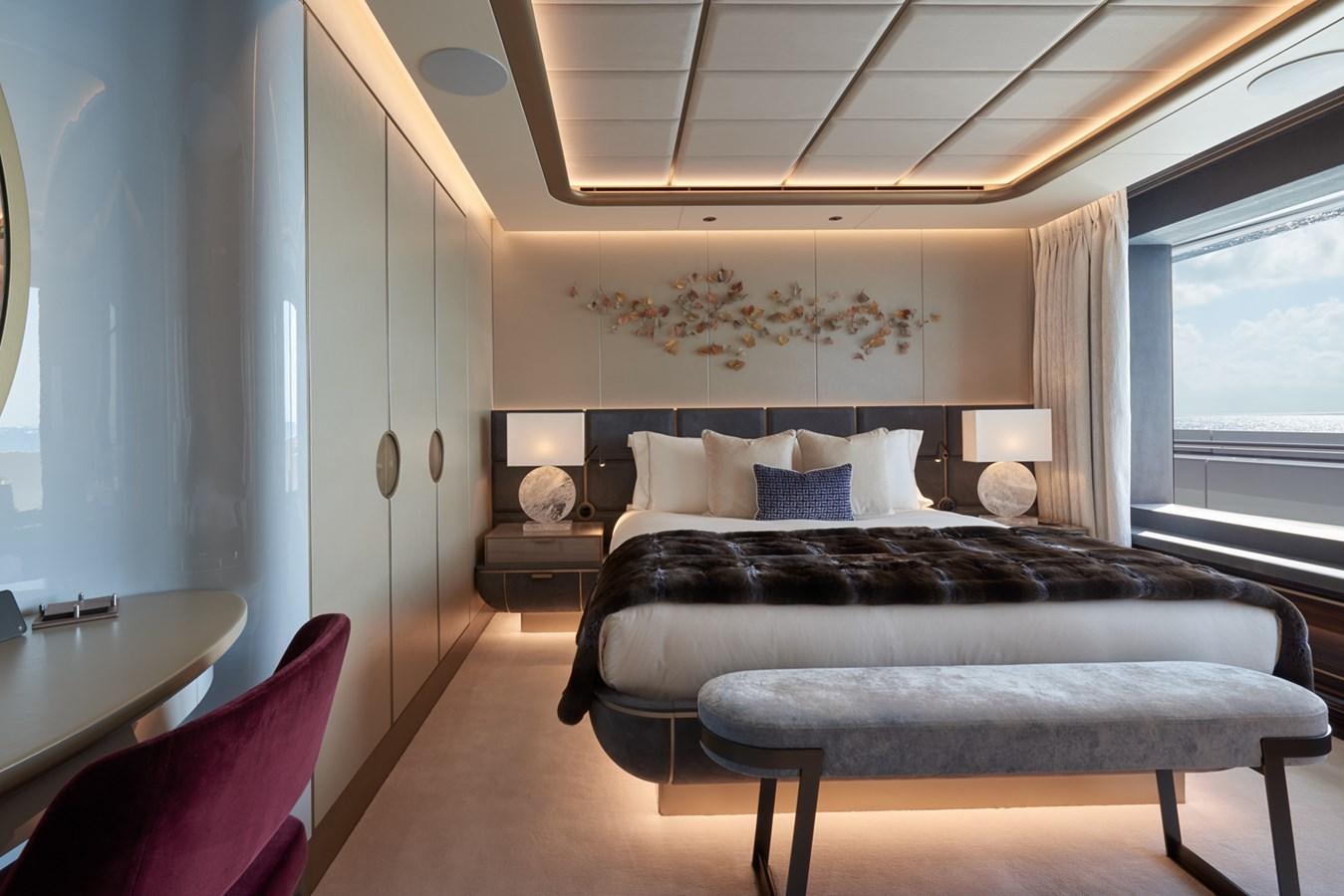 a bedroom with a large bed aboard ARROW Yacht for Charter