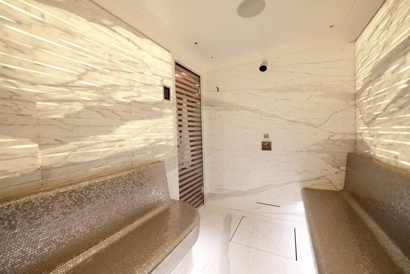 a white room with a staircase aboard ARROW Yacht for Charter