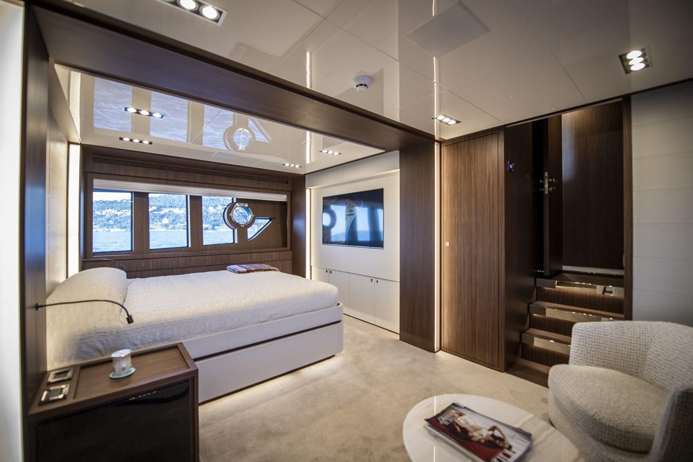 a living room with a couch and a tv aboard WILD ONE Yacht for Sale