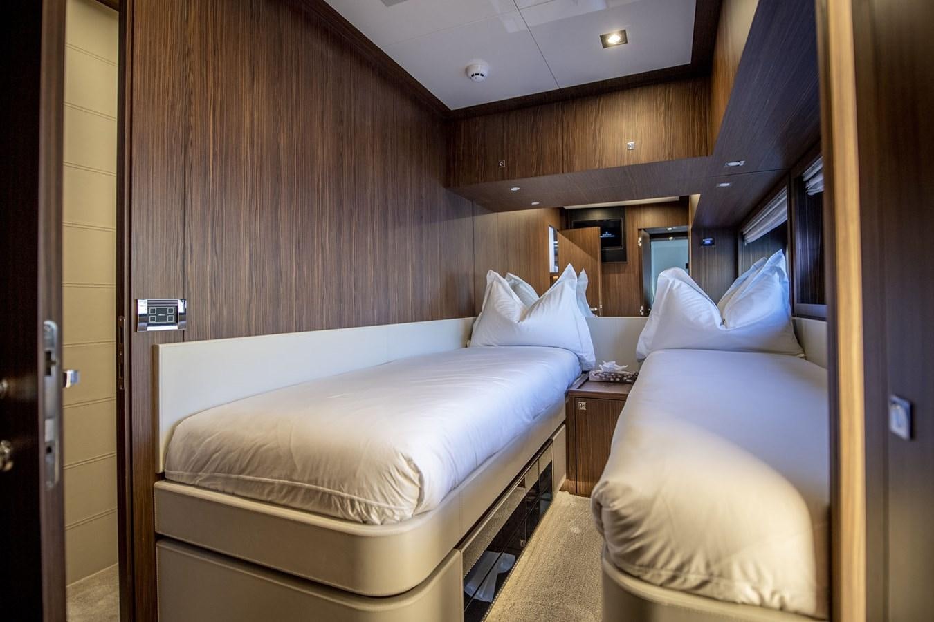 a room with two beds aboard WILD ONE Yacht for Sale