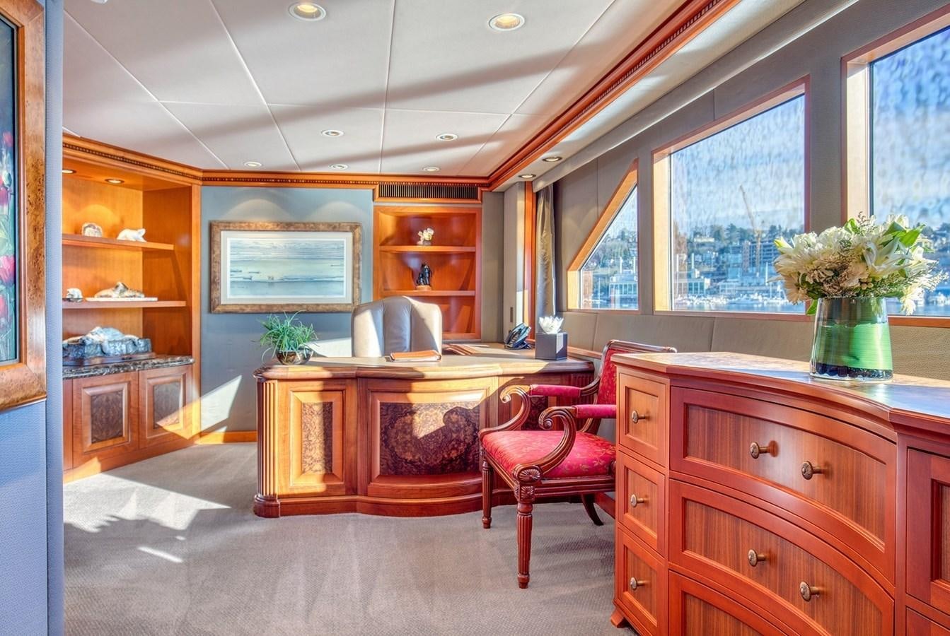 a room with a desk and chairs aboard ICE BEAR Yacht for Sale