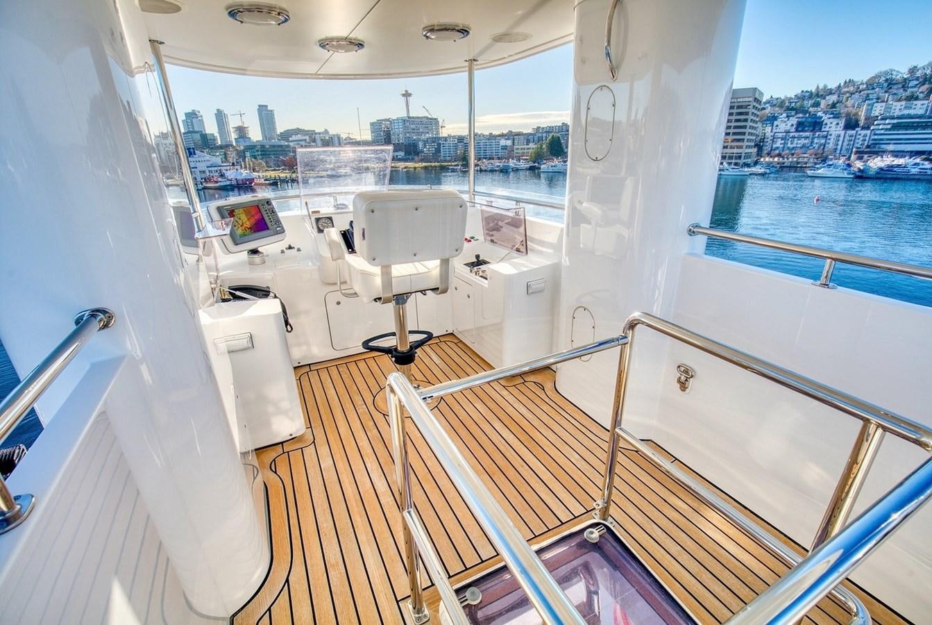 a deck with a view of a city and water aboard ICE BEAR Yacht for Sale