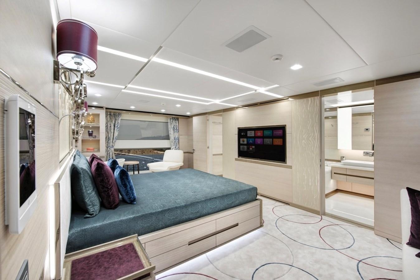 a bedroom with a bed and a television aboard CHARADE Yacht for Sale