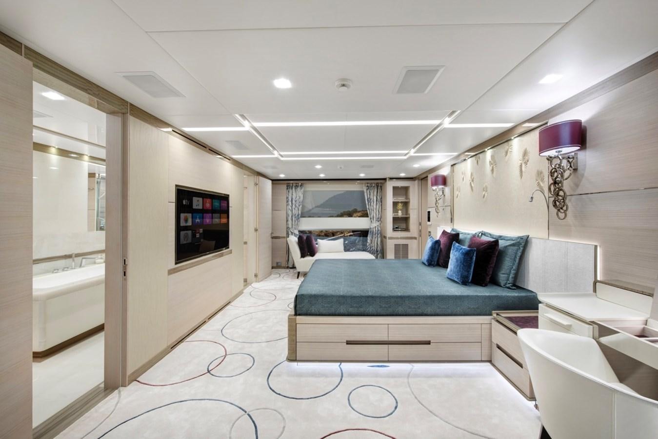 a bedroom with a bed and a tv aboard CHARADE Yacht for Sale