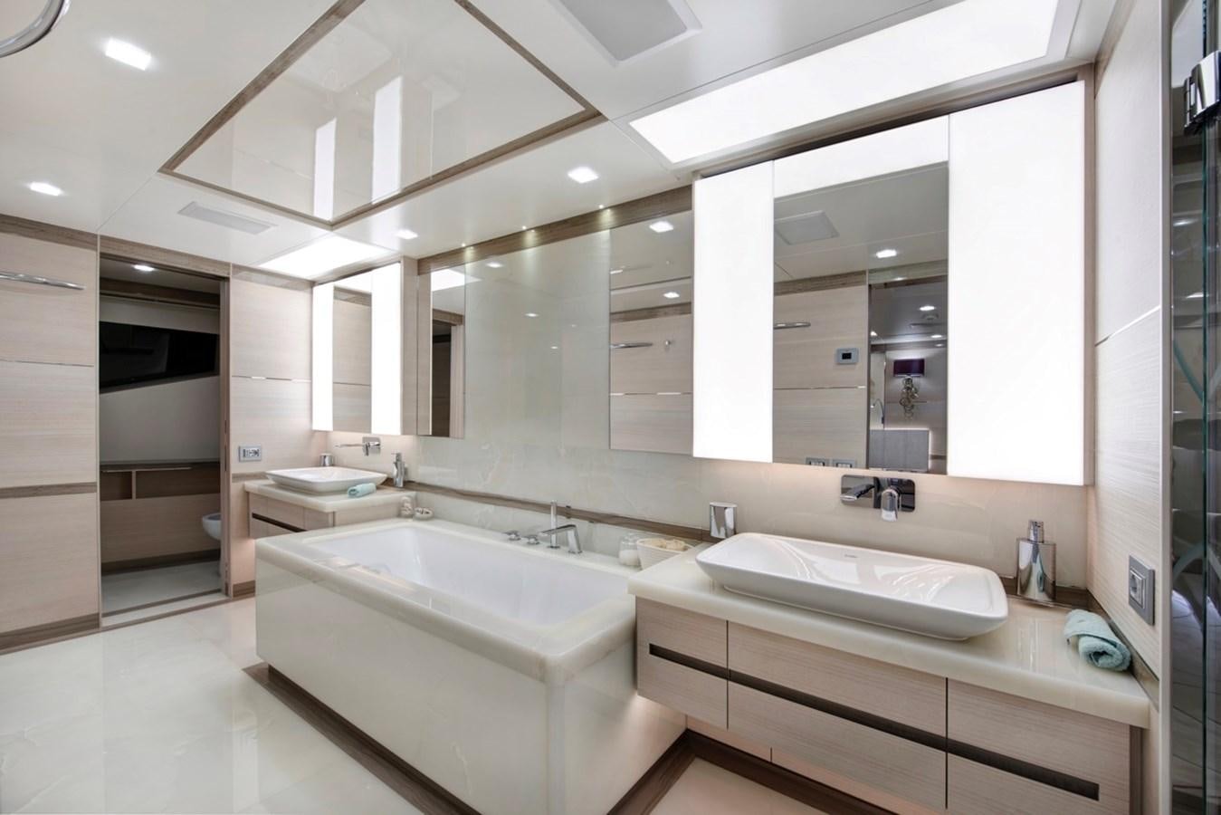 a bathroom with sinks and mirrors aboard CHARADE Yacht for Sale