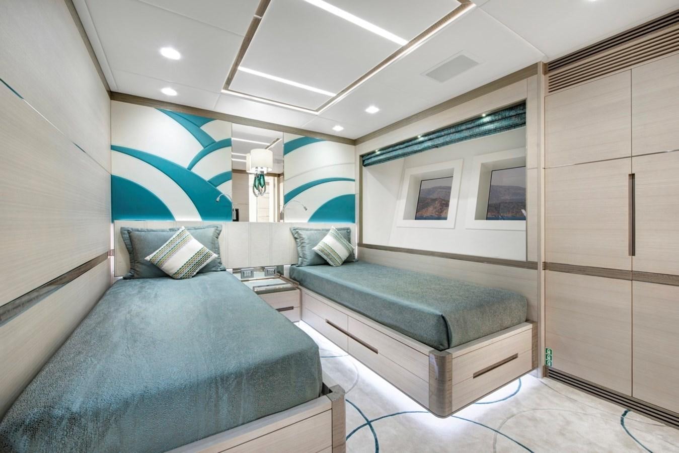 a room with a bed and a couch aboard CHARADE Yacht for Sale