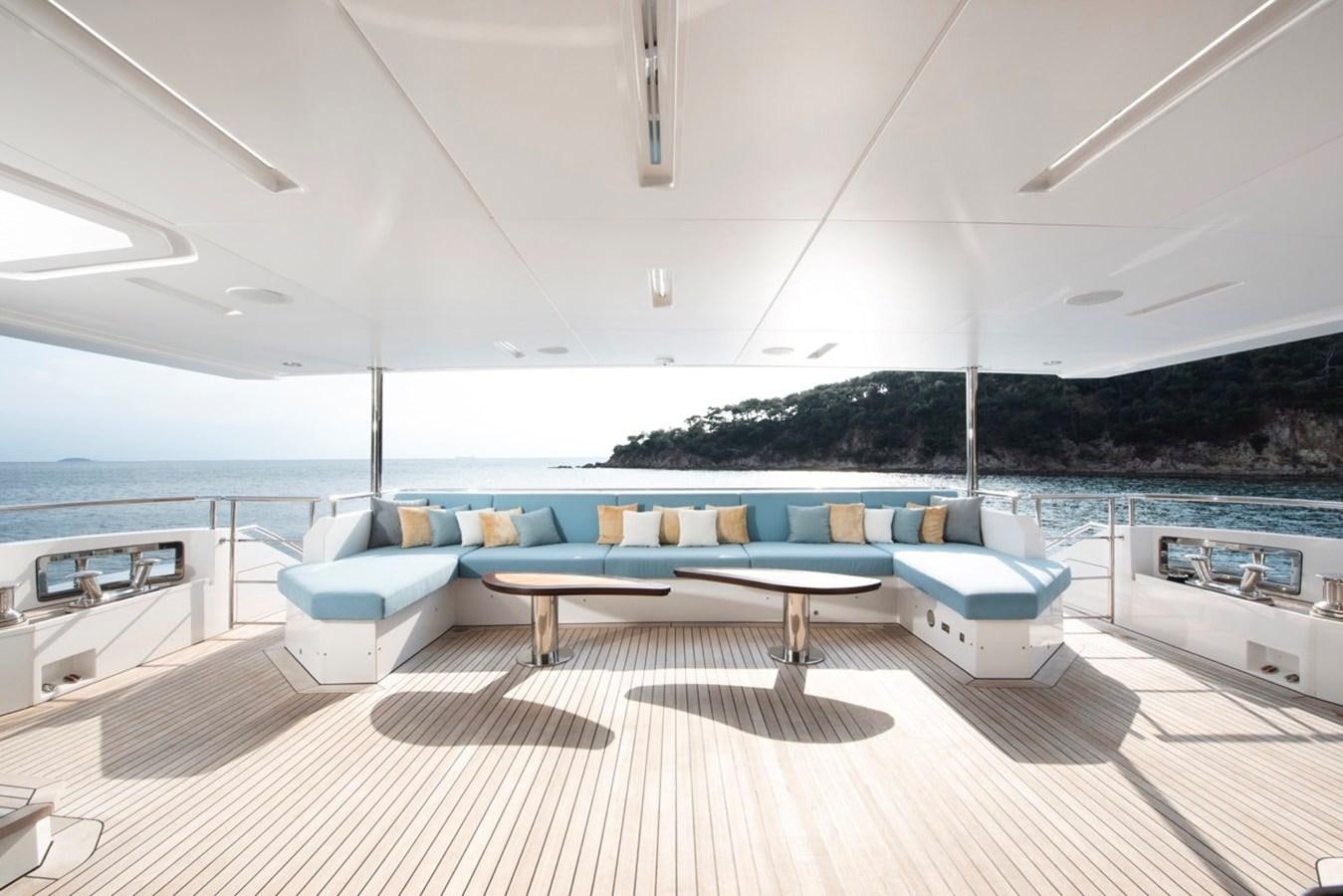 a room with a couch and a pool aboard CHARADE Yacht for Sale