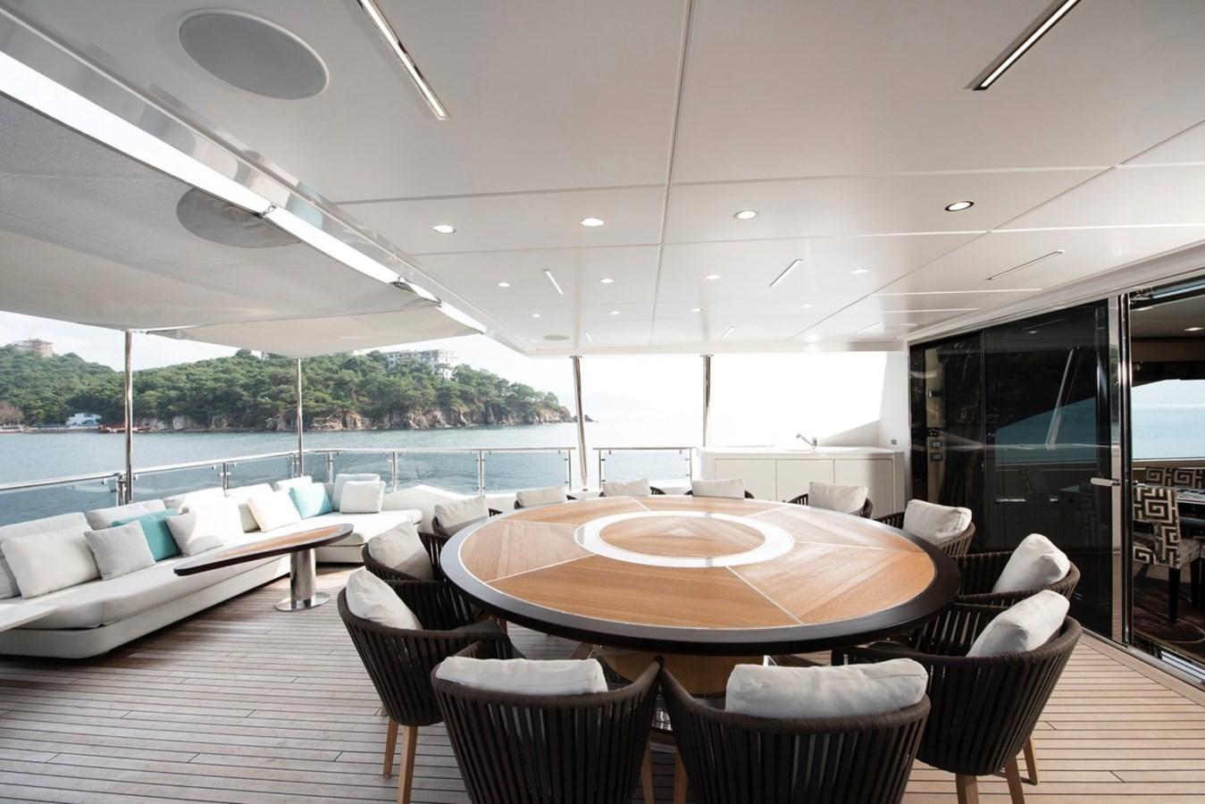 a room with a table and chairs aboard CHARADE Yacht for Sale