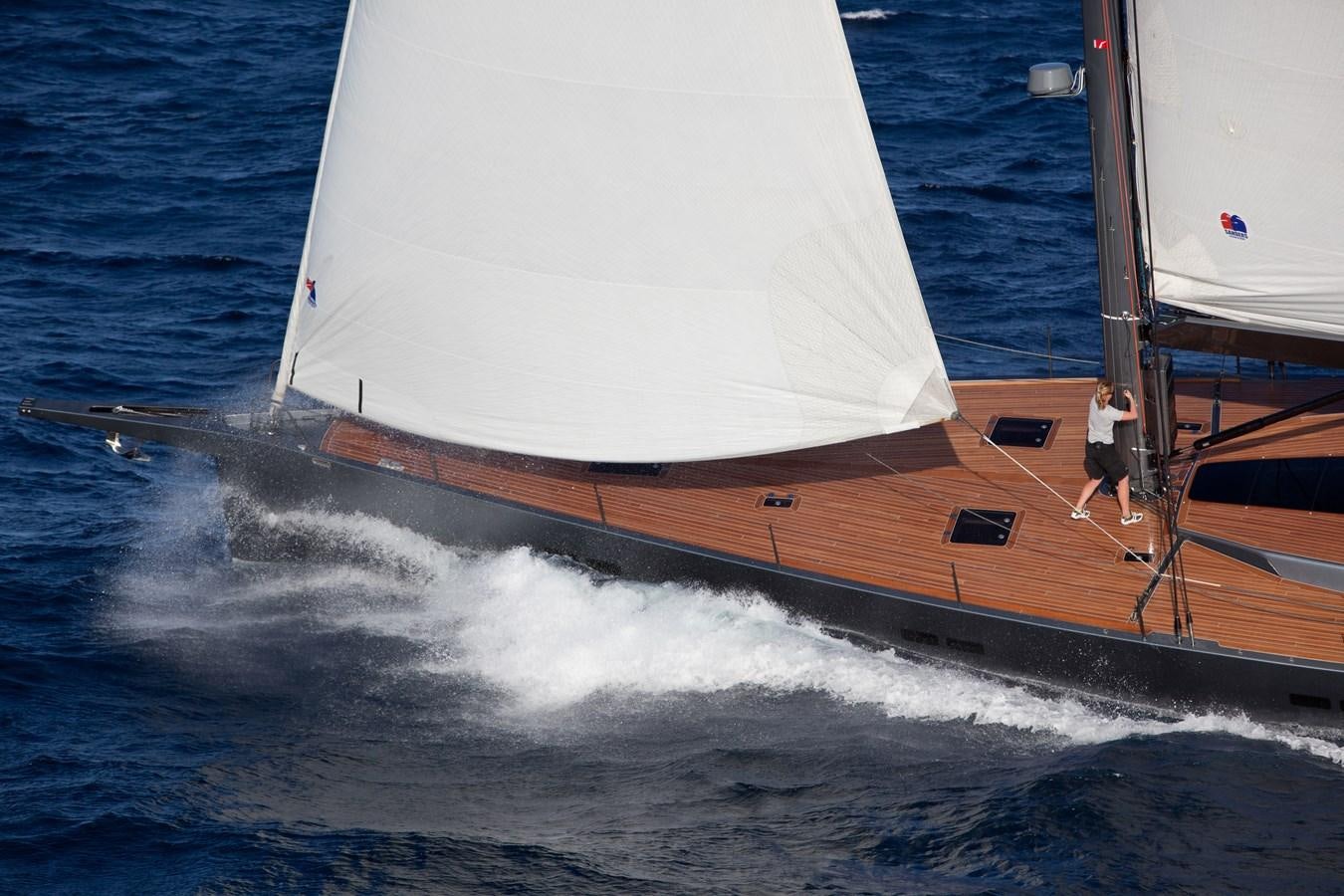 a man standing on a boat aboard AEGIR Yacht for Sale