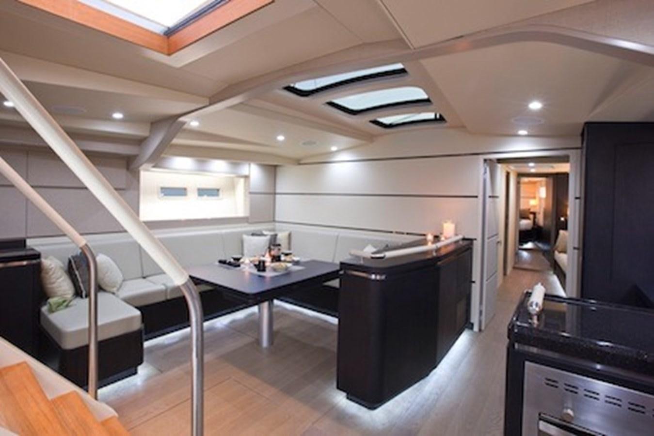 a room with a table and chairs aboard AEGIR Yacht for Sale