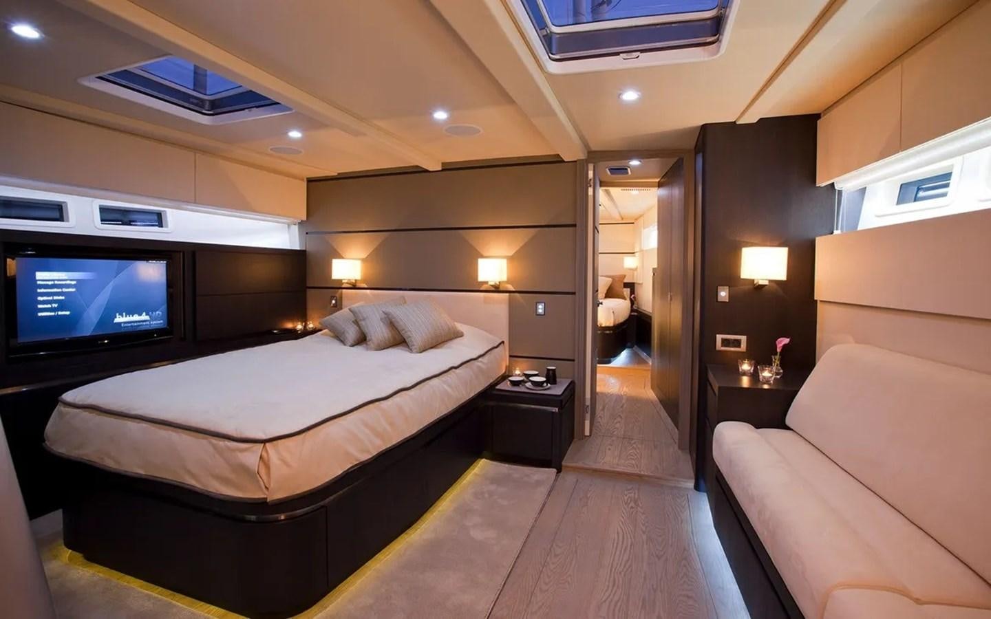 a hotel room with a bed and a television aboard AEGIR Yacht for Sale