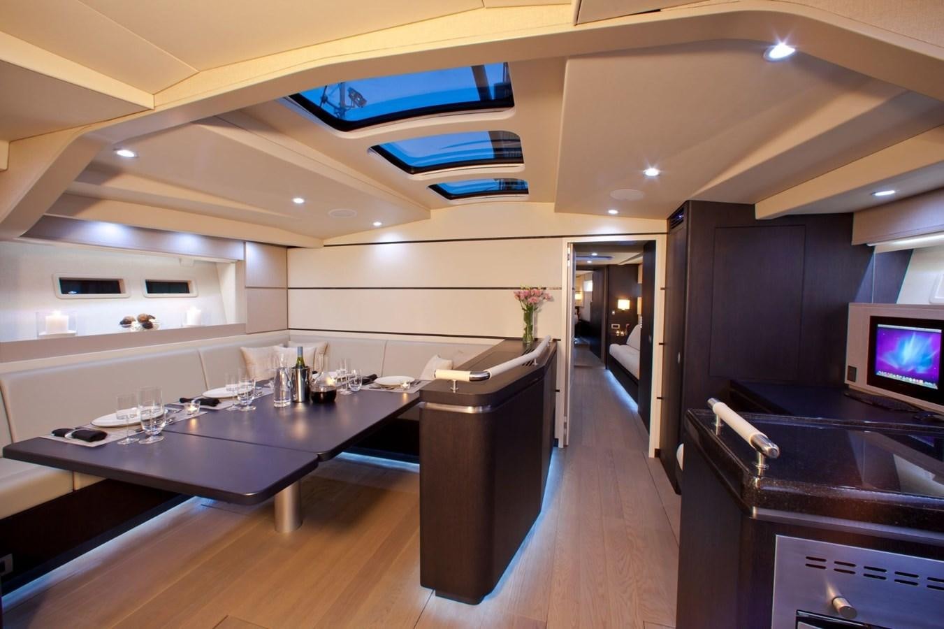 a large kitchen with a bar and a large island aboard AEGIR Yacht for Sale