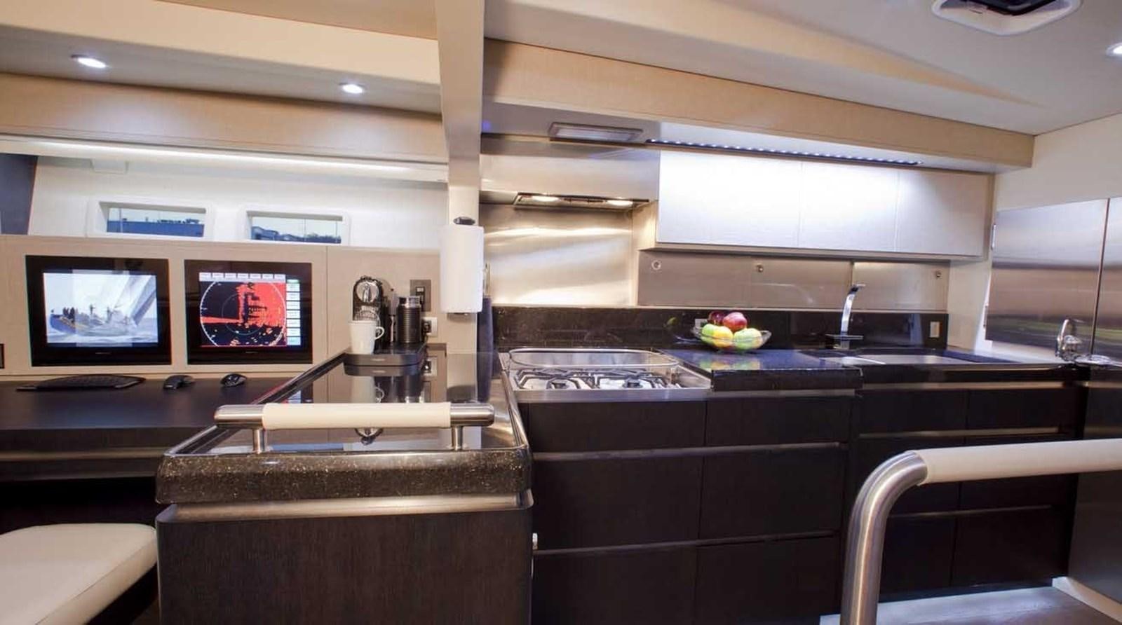 a kitchen with a large tv aboard AEGIR Yacht for Sale