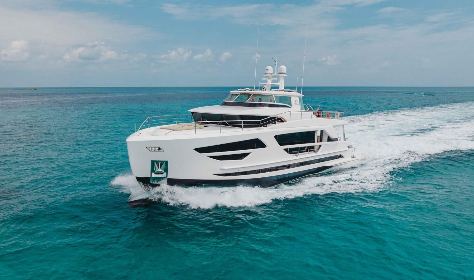 a white boat on the water aboard MIDNIGHT MOON Yacht for Sale