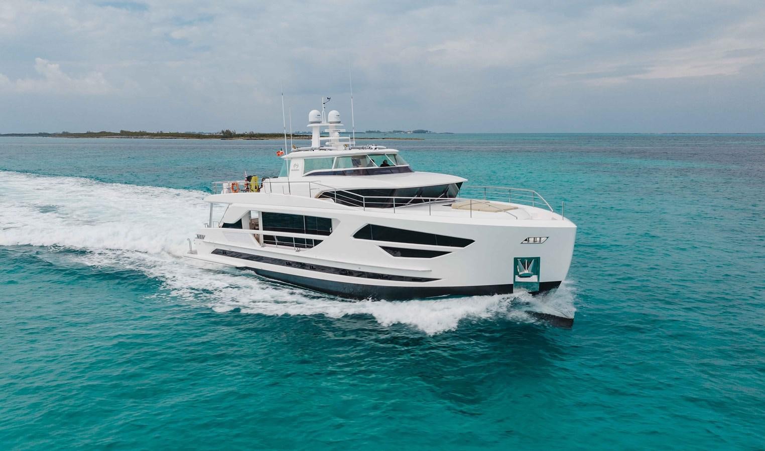 a white boat on the water aboard MIDNIGHT MOON Yacht for Sale