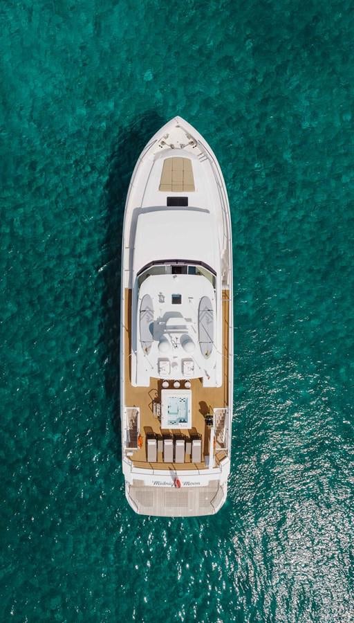 a small white ship on a green surface aboard MIDNIGHT MOON Yacht for Sale