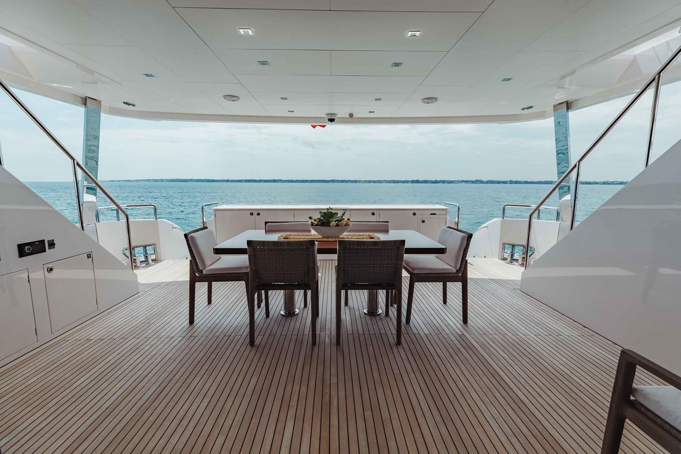a table and chairs on a deck aboard MIDNIGHT MOON Yacht for Sale
