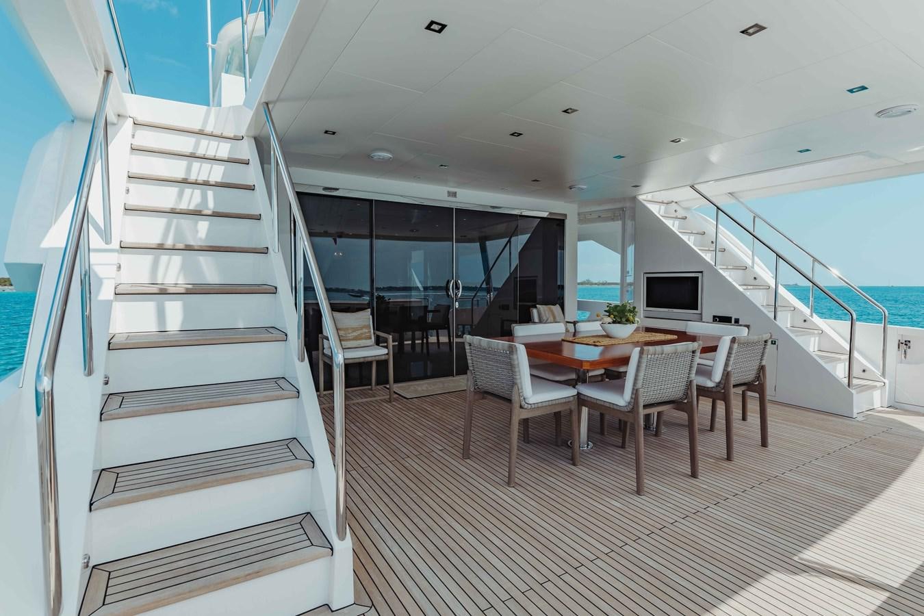 a room with a table and chairs aboard MIDNIGHT MOON Yacht for Sale