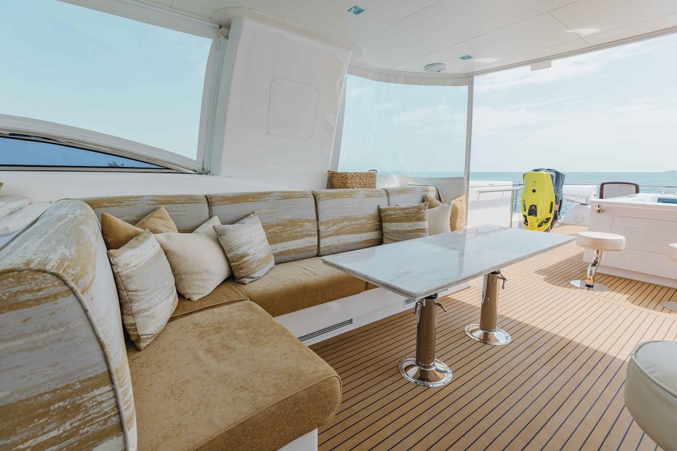 a living room with a couch and a table aboard MIDNIGHT MOON Yacht for Sale