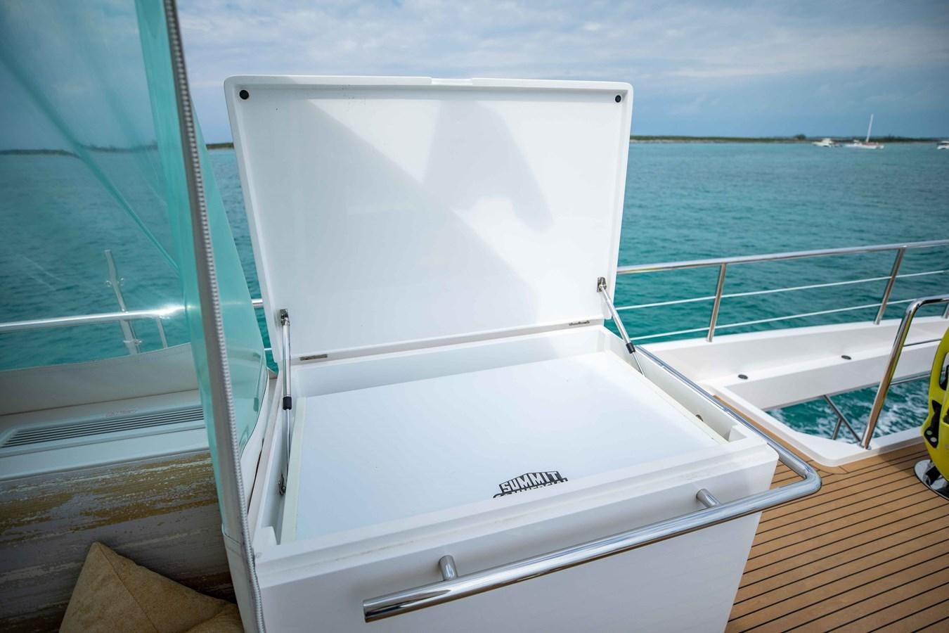 a white boat on a dock aboard MIDNIGHT MOON Yacht for Sale