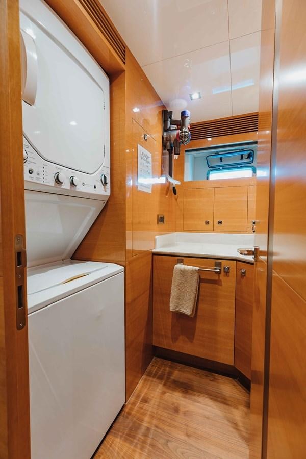 a bathroom with wooden cabinets aboard MIDNIGHT MOON Yacht for Sale