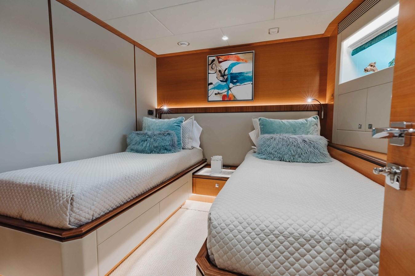 a couple of beds in a hotel room aboard MIDNIGHT MOON Yacht for Sale