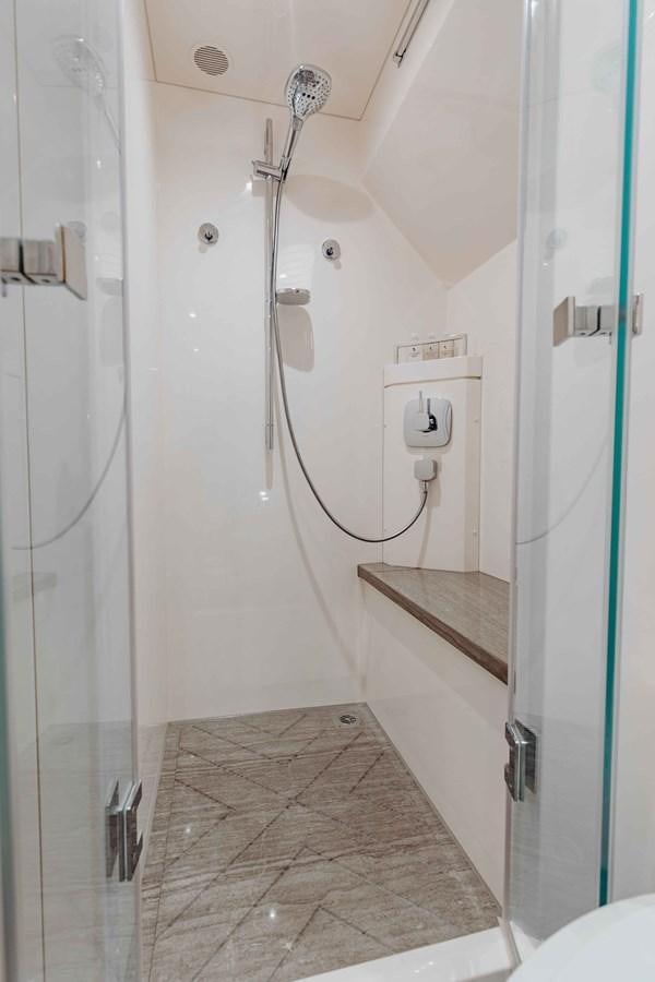 a bathroom with a shower unit aboard MIDNIGHT MOON Yacht for Sale