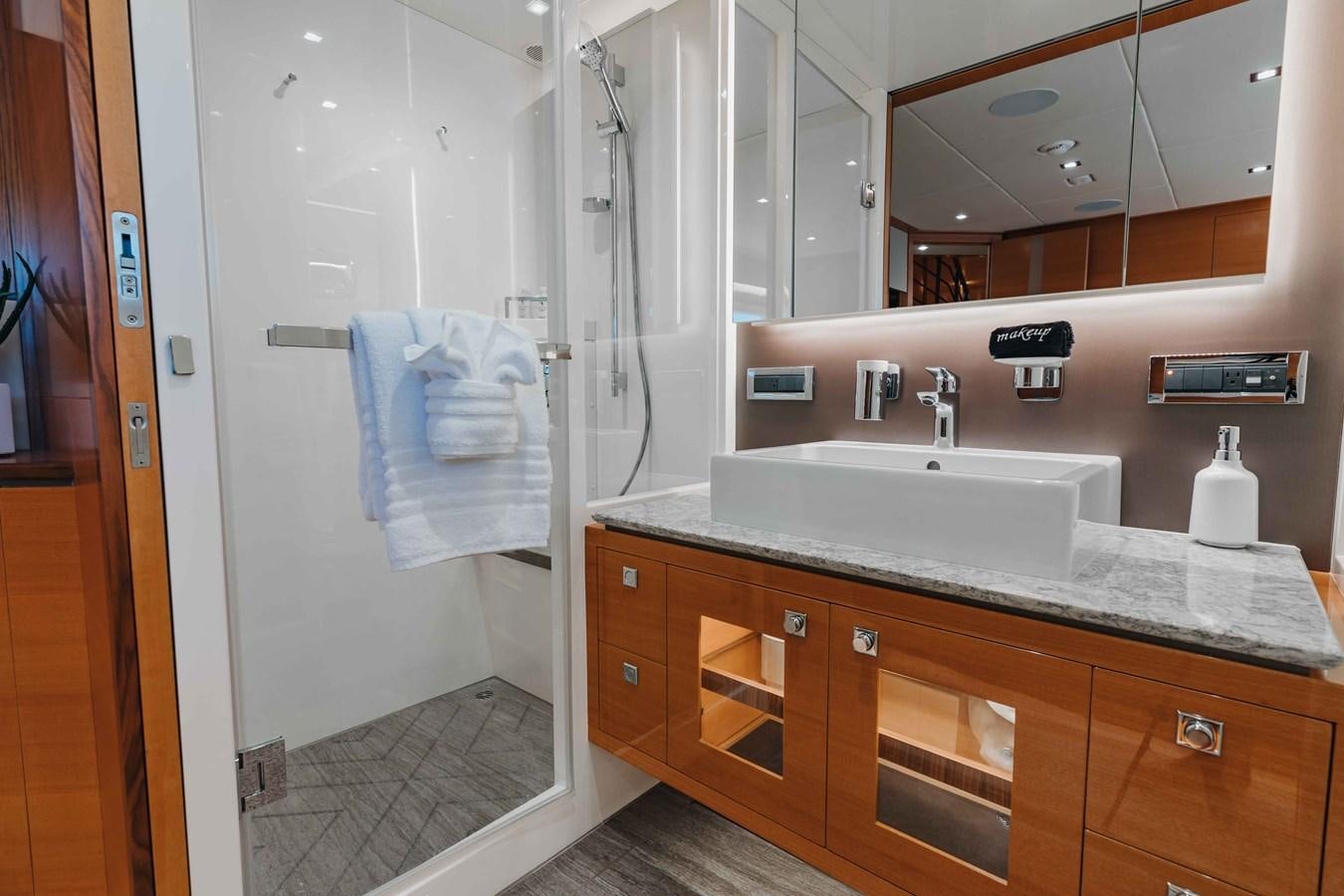 a bathroom with a sink and a shower aboard MIDNIGHT MOON Yacht for Sale