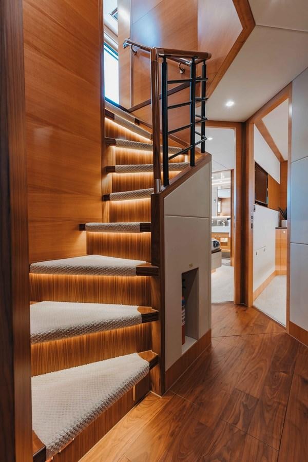 a wooden staircase with a glass door aboard MIDNIGHT MOON Yacht for Sale