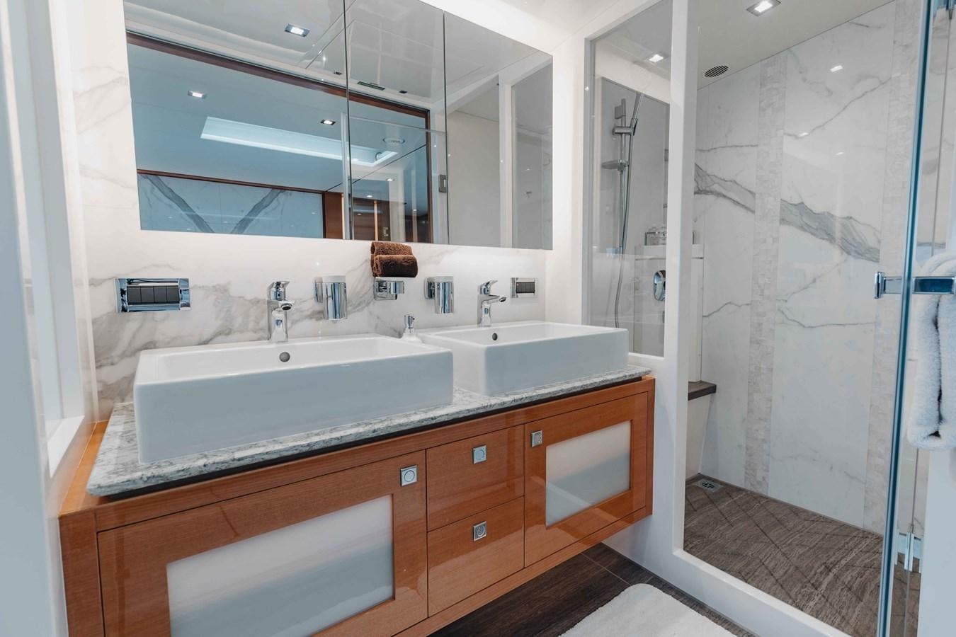 a bathroom with a sink and a mirror aboard MIDNIGHT MOON Yacht for Sale