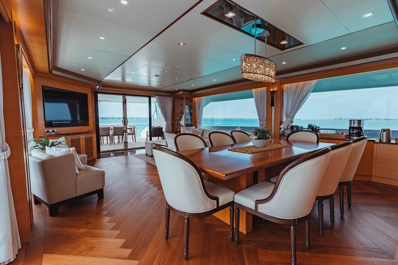 a large dining room with a table and chairs aboard MIDNIGHT MOON Yacht for Sale