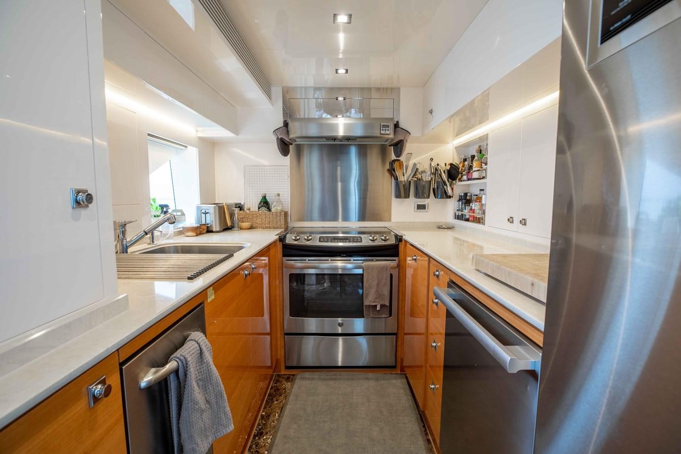 a kitchen with a stainless steel oven aboard MIDNIGHT MOON Yacht for Sale