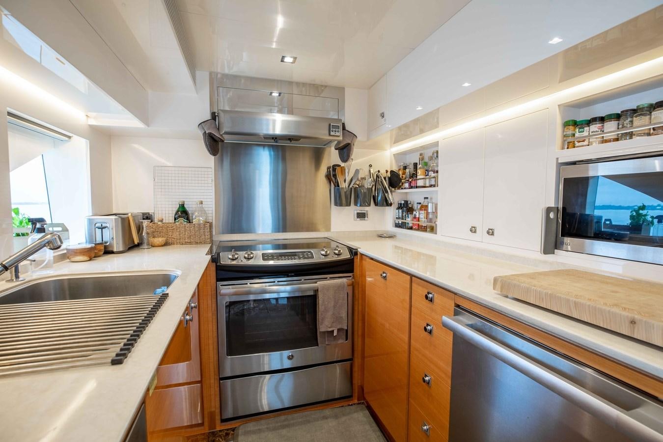 a kitchen with a stainless steel stove aboard MIDNIGHT MOON Yacht for Sale