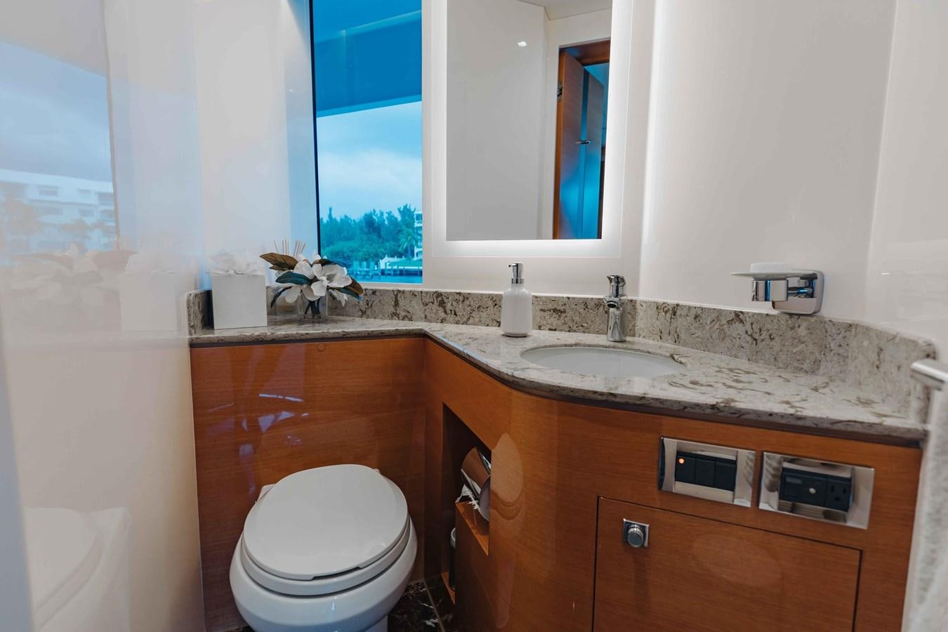 a bathroom with a sink and a toilet aboard MIDNIGHT MOON Yacht for Sale