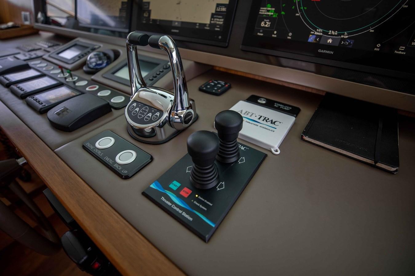 a desk with a computer and other electronics on it aboard MIDNIGHT MOON Yacht for Sale