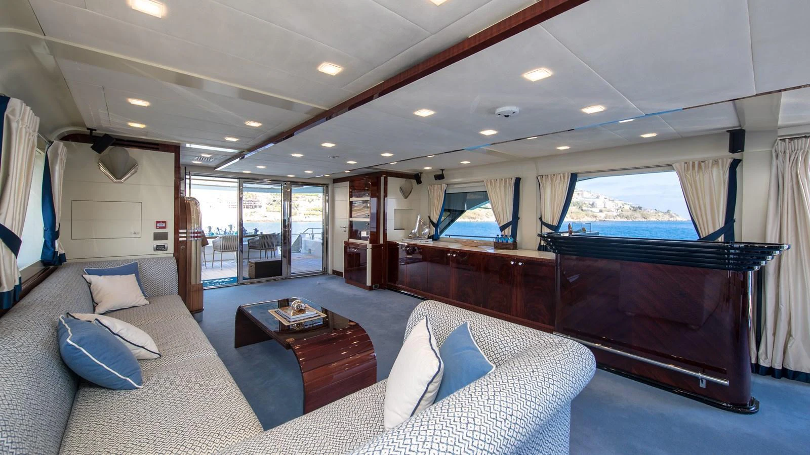 a large living room with a large bed and a large window aboard LADY MARISA Yacht for Sale