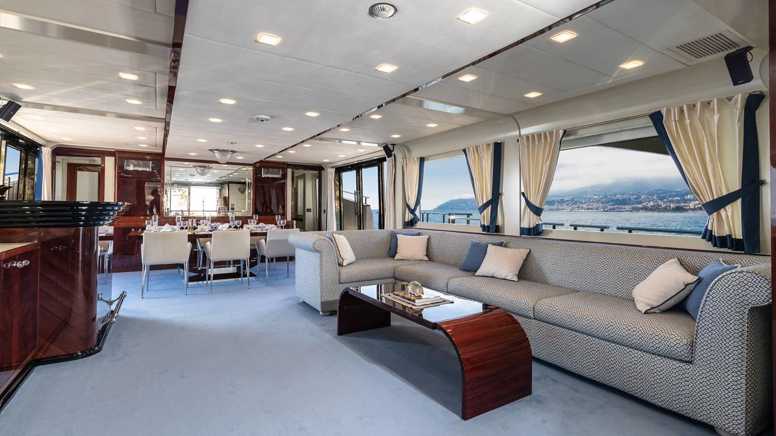 a large living room with a large window aboard LADY MARISA Yacht for Sale