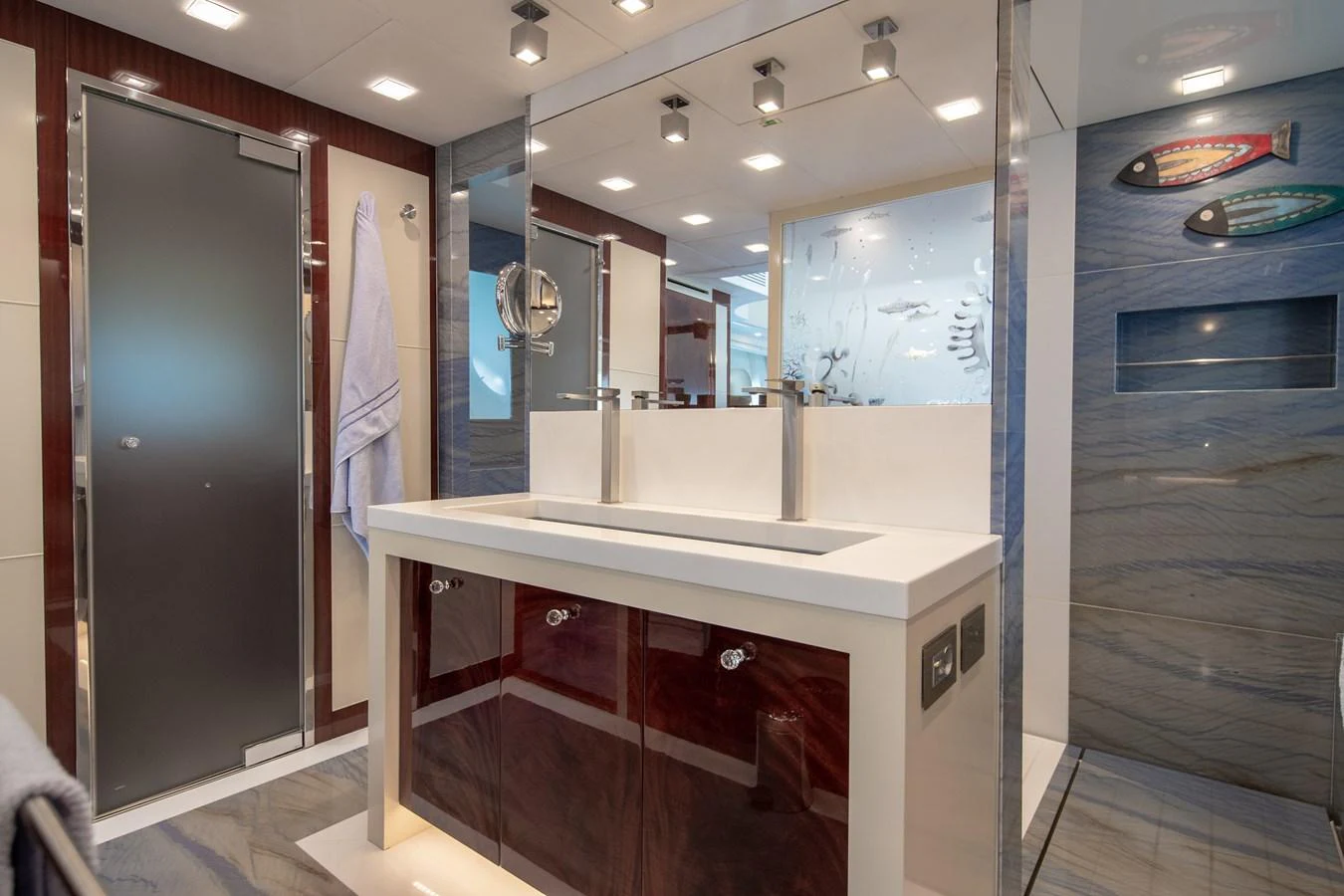 a bathroom with a countertop sink and a mirror aboard LADY MARISA Yacht for Sale
