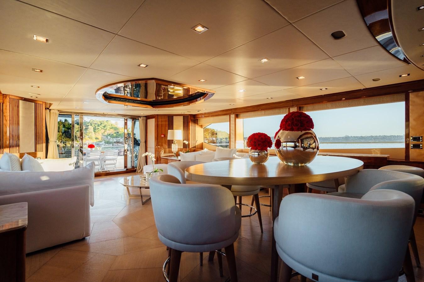 a room with a table and chairs aboard CHAOS Yacht for Sale