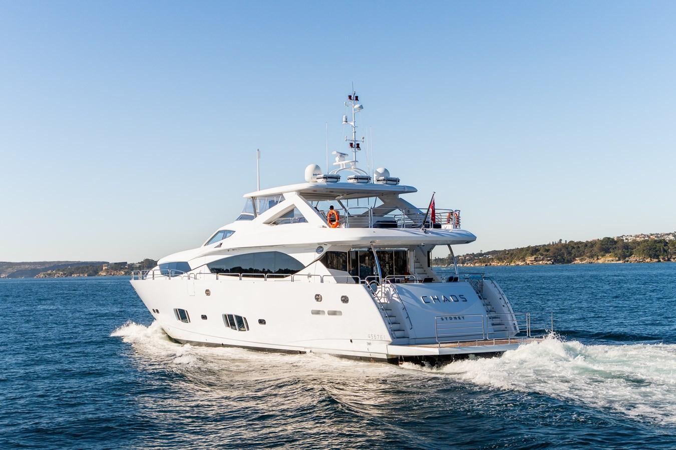 a white boat on water aboard CHAOS Yacht for Sale