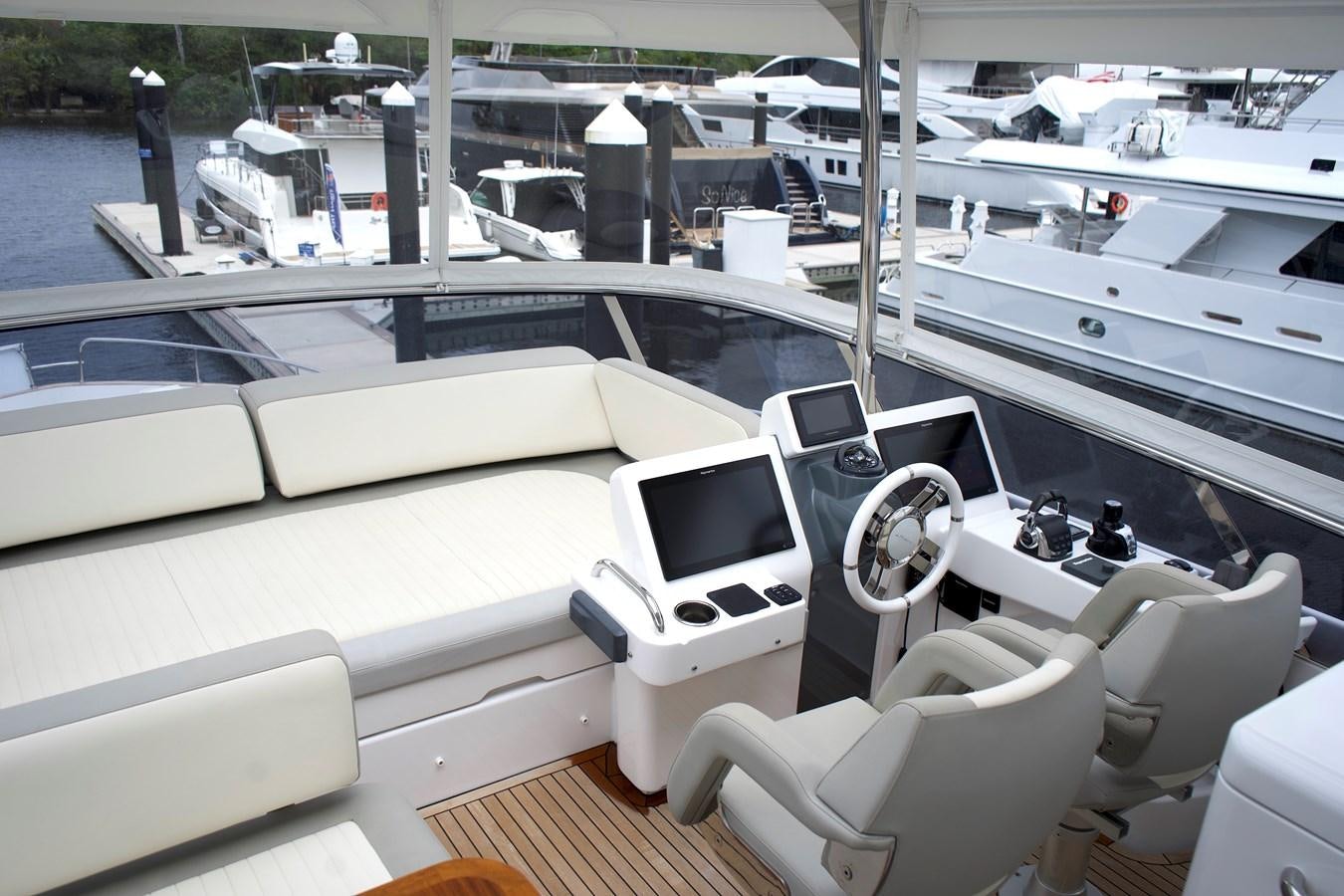 a boat with a steering wheel aboard RAINBOW GODDESS Yacht for Sale